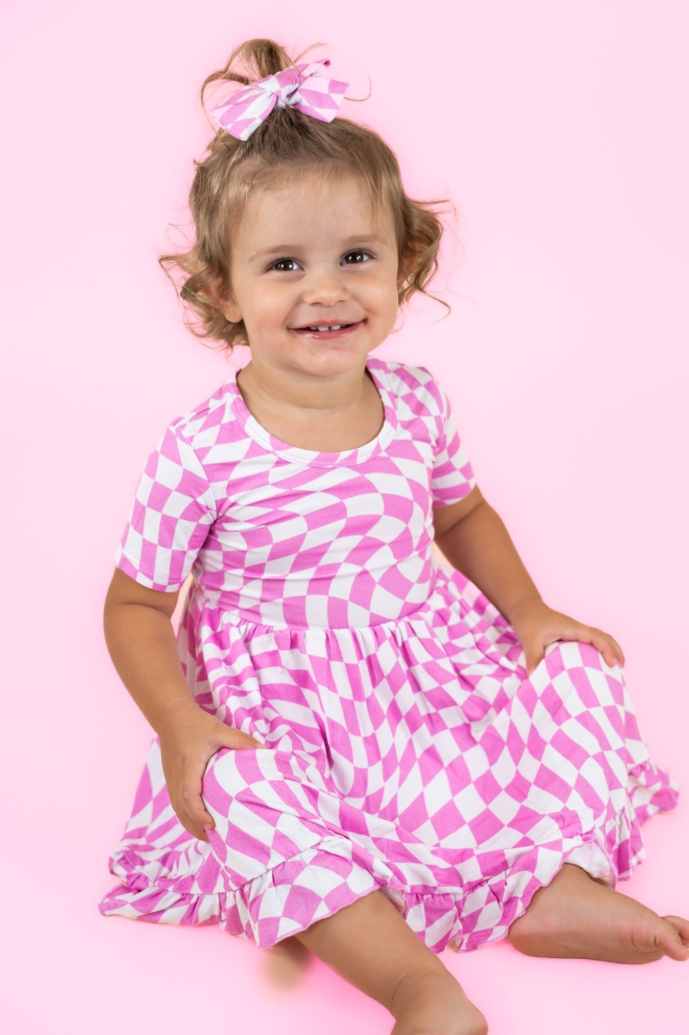 BUBBLEGUM WAVY CHECKERS DREAM RUFFLE DRESS - Mack & Harvie