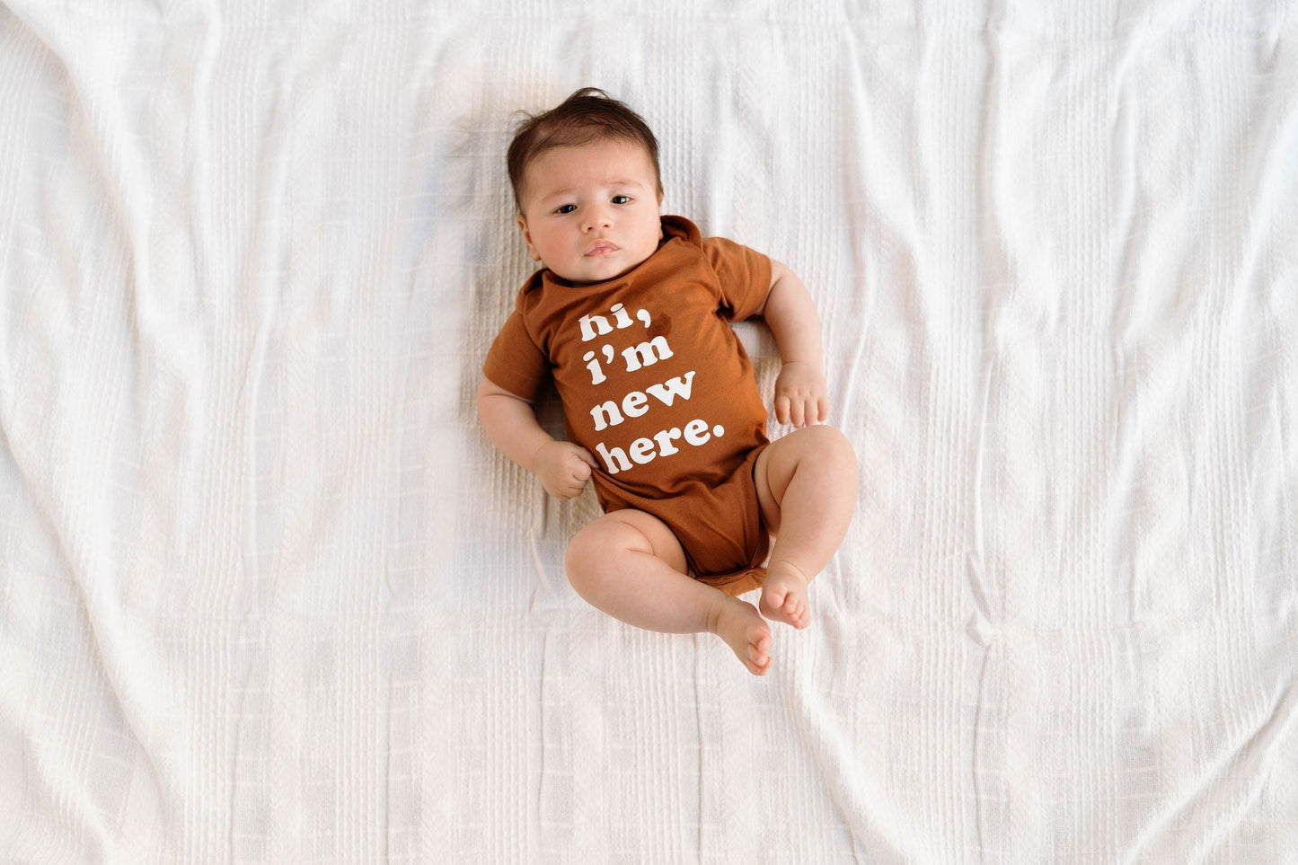 Hi, I'm New Here Baby Onesie in Pecan - Mack & Harvie